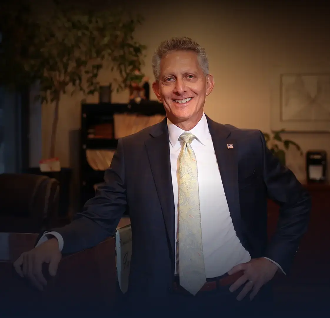 Picture of andrew karpf smiling in his office